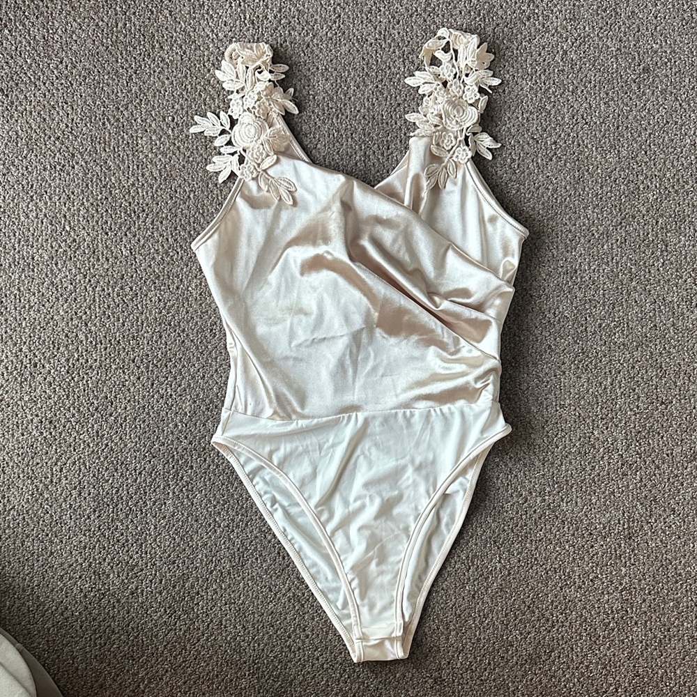 Elegant Cream Bodysuit with Floral Straps